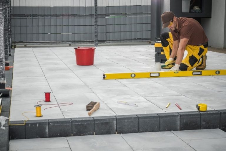 Contractor Checking Concrete Porch Leveling